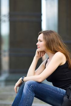 Attractive woman sit on stair look forward