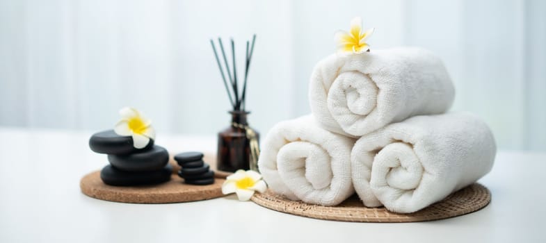 Spa accessory composition set in day spa hotel , beauty wellness center . Spa product are placed in luxury spa resort room , ready for massage therapy from professional service .