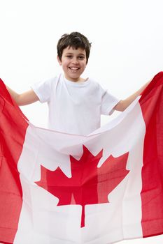 American teenage boy carries Canadian flag, celebrates Independence Day of Canada, July 1, isolated over white background, with advertising space for text. Citizenships Patriotism Emigration Concept