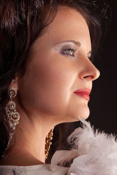 Close-up portrait of sensual woman with boa