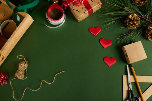 Beautiful Christmas background with wrapping materials and heart shaped decors for packing presents. Copy advertising space. Mockup. Boxing Day