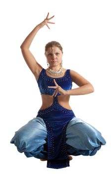 Young woman posing in arabia dance - traditional blue costume