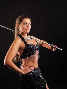 woman dance in traditional arabia costume with cane