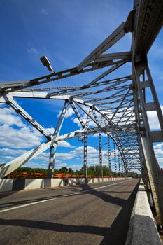 Metal bridge and sky with clouds