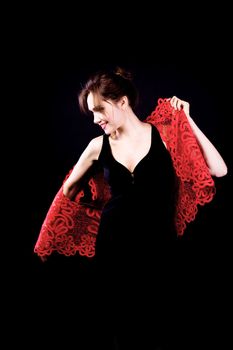 Woman in black dress with red lacy jacket