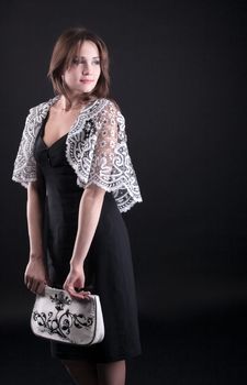 Beauty woman in lacy jacket and handbag with lace