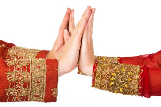 two hands in indian dress man and woman
