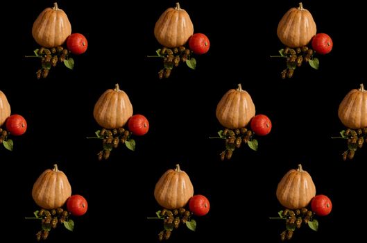 Whole organic pumpkins of various sizes and hop cones - humulus lupulus, on black background. Craft from autumn seasonal vegetables - witch on a broomstick. Halloween Thanksgiving. Copy space. Pattern