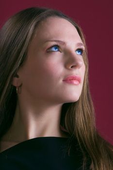 pretty woman look up portrait on red