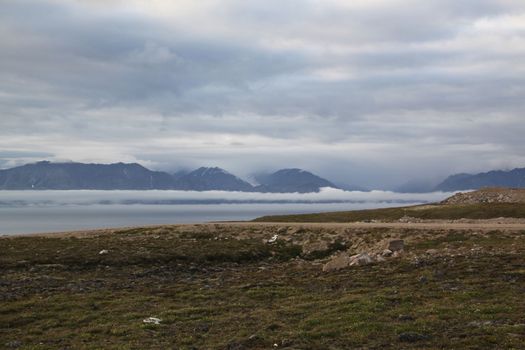 View of mountains across the bay from the community of Pond Inlet in the Baffin Region of the territory of Nunavut, Canada