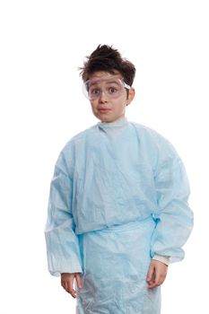 Vertical studio shot of an amazed smart teenage boy, nerd chemist scientist in labwear and goggles, looking at camera with astonishment, isolated on white background with free advertising space
