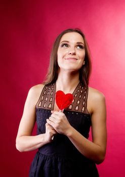 happy young woman smile with red lollipop