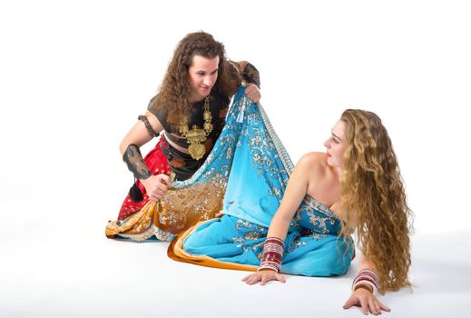 Man undress woman with violence - traditional indian costume