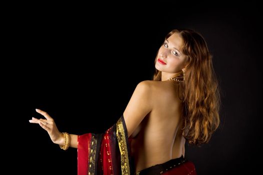 Pretty young woman with naked spine in traditional dress
