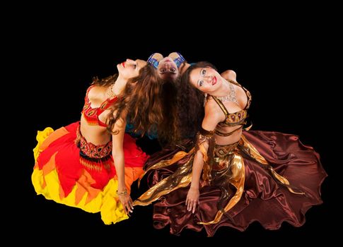 Three young woman in traditional arabic costume