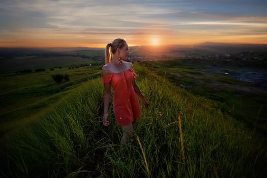 Fashion Gir. Beautiful fashionable glamor girl shows poses in modern clothes against the backdrop of beautiful scenery and flawless nature. creative photo. High quality photo