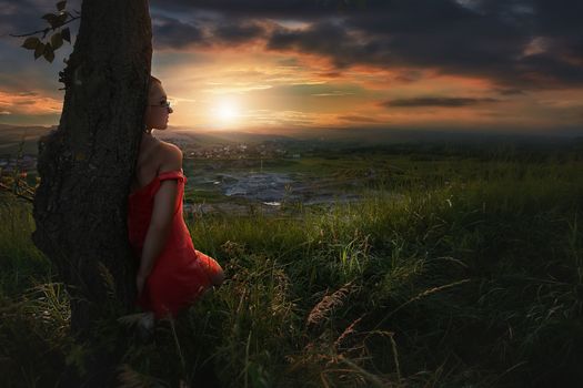 Fashion Gir. Beautiful fashionable glamor girl shows poses in modern clothes against the backdrop of beautiful scenery and flawless nature. creative photo. High quality photo