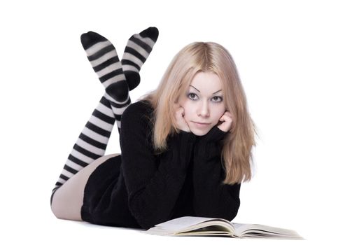 young woman lay with book with naked leg