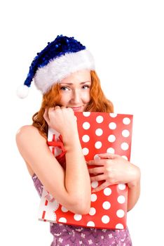 red girl with christmas present bag look at you