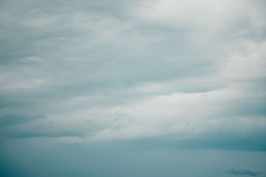 Overcast sky on rainy day with Nimbostratus clouds. Gloomy and moody background. Overcast clouds. Bad weather. Sad and depressed background