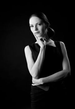Young beauty woman portrait black and white in dark