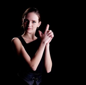 Young woman portrait with hands in gun sign
