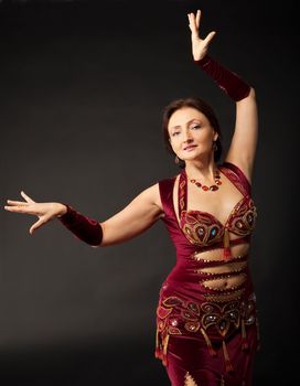 Beauty mature woman dance in arabic costume
