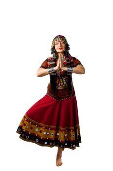 Mature woman stand in yoga pose - traditional indian costume