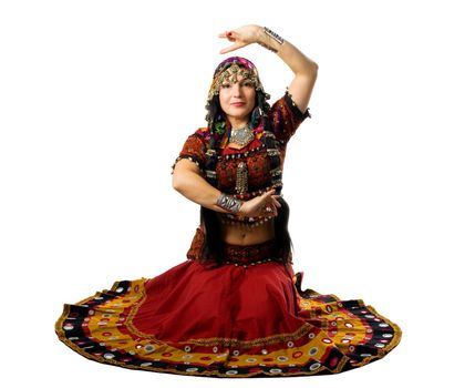 Mature woman sit in traditional indian costume with hand sign