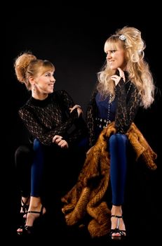 Two pretty sisters talk in lace costume
