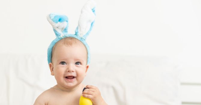 Boy dressed as bunny and Easter eggs.