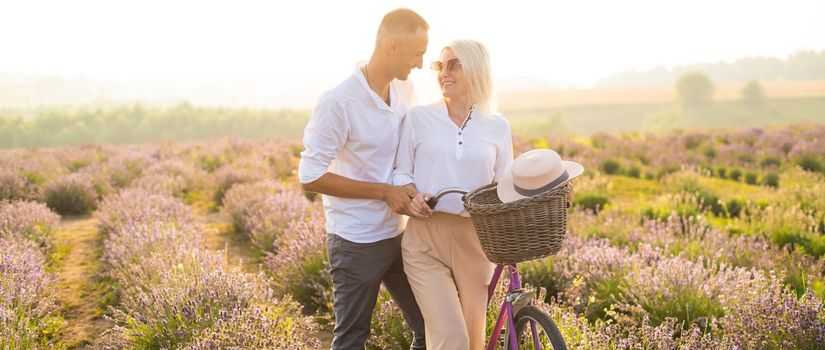 Beautiful couple on the lavender field.