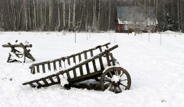wooden house in winter forest