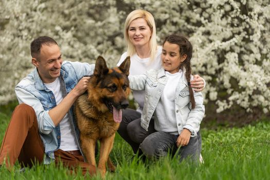 Happy family having picnic in nature. Smiling family picnicking in the park. spring nature.