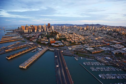 an aerial view of downtown san francisco with pier during sunset