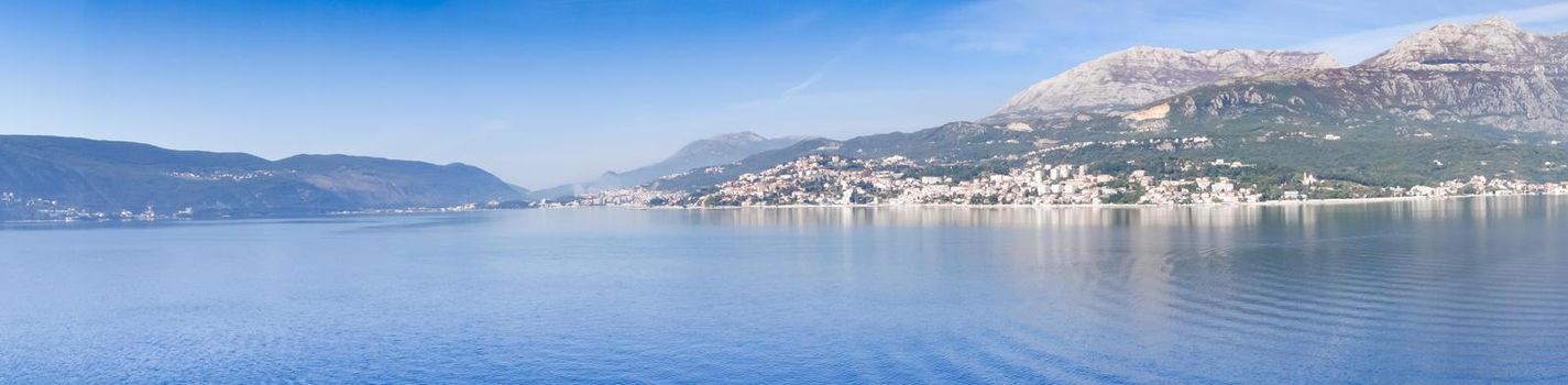 Panoramic view of Bay of Kotor from the sea surrounded by mountains in Montenegro, one of the most beautiful bay in the world.