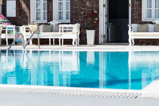 private pool and sun loungers in the sun