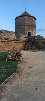 Ruined old fortress on the seashore. Blue sky. Architectural monument. Summer sea landscape. Rest.