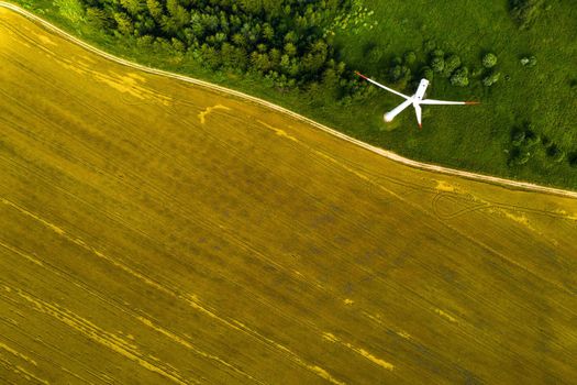 Windmills on the background of forests and fields. Windmill in nature.Belarus.