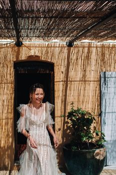 a beautiful bride with pleasant features in a wedding dress is photographed in Provence. Portrait of the bride in France.