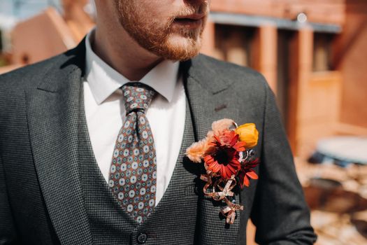 Groom in a jacket and boutonniere close-up.Groom close-up in Provence, France, the groom's fees