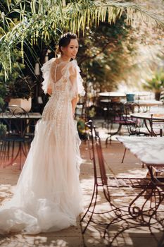 a beautiful bride with pleasant features in a wedding dress is photographed in Provence. Portrait of the bride in France.