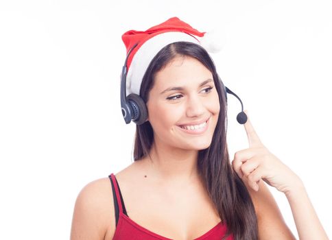 Christmas headset woman from telemarketing call center wearing red santa hat talking smiling isolated on white background.