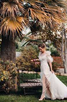 a beautiful bride with pleasant features in a wedding dress is photographed in Provence. Portrait of the bride in France.