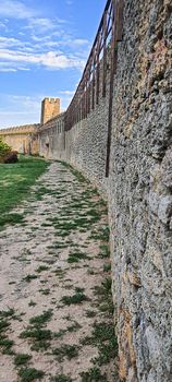 Ruined old fortress on the seashore. Blue sky. Architectural monument. Summer sea landscape. Rest.