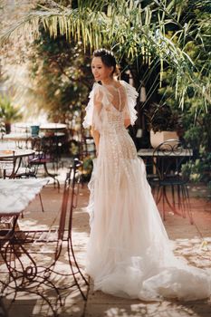 a beautiful bride with pleasant features in a wedding dress is photographed in Provence. Portrait of the bride in France.