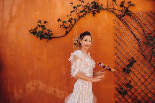 a beautiful bride with pleasant features in a wedding dress is photographed in Provence. Portrait of the bride in France.