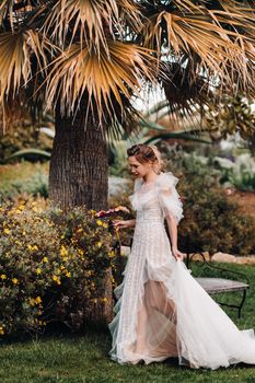 a beautiful bride with pleasant features in a wedding dress is photographed in Provence. Portrait of the bride in France.