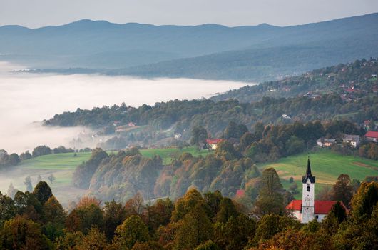 Morning fog and a church in the valley, clouds and fog scenery