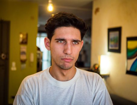 Close up of a Pensive Handsome Young Man with Sad Face, Looking away, Worried or Upset.